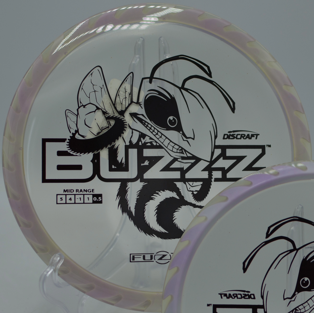 Discraft Fuzed Buzzzsaw gliding on a straight laser line at Iron Hill Disc Golf Course in Newark, Delaware.