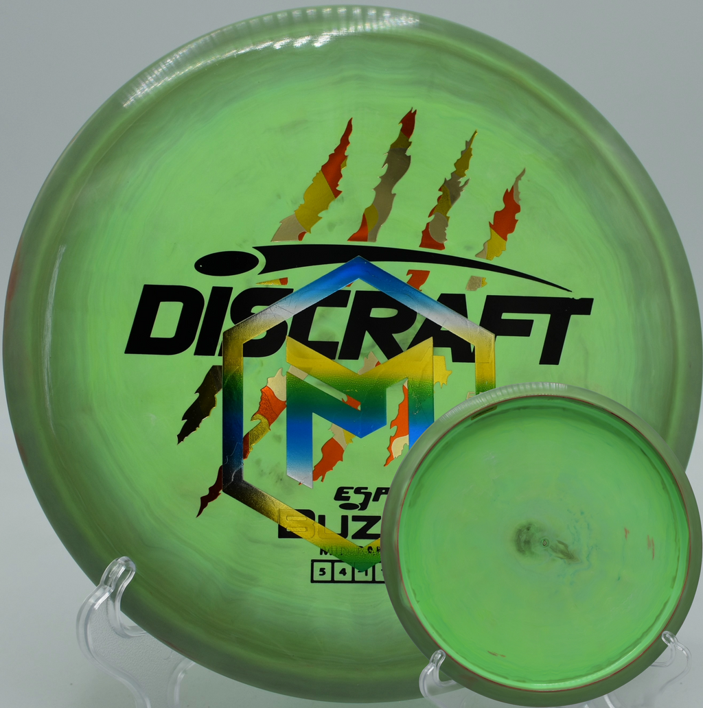 Signature edition 4 Claw Buzzz gliding through tight trees at Idlewild Disc Golf Course in Burlington, Kentucky.