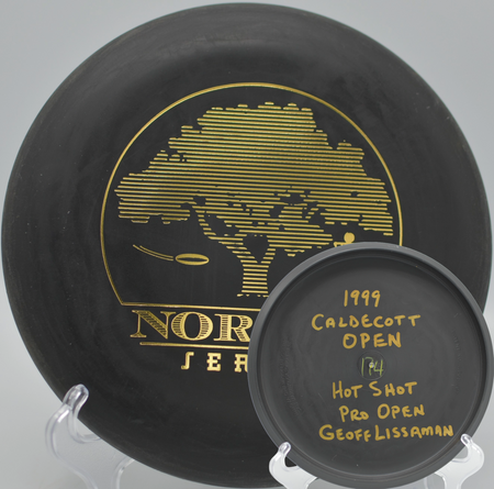 Black 2-Ring San Marino Microbead Aviar w/Pat# (NorCal Series 97–02) sinking a confident putt at Auburn Regional Park Disc Golf Course in Auburn, California.