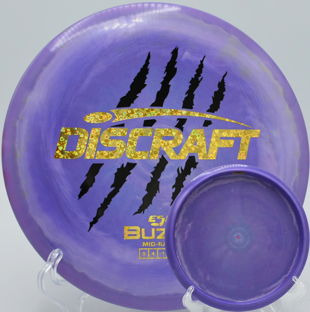 Discraft 4 Claw Buzzz drifting through a wooded lane at The Preserve Championship course in Clearwater, Minnesota.