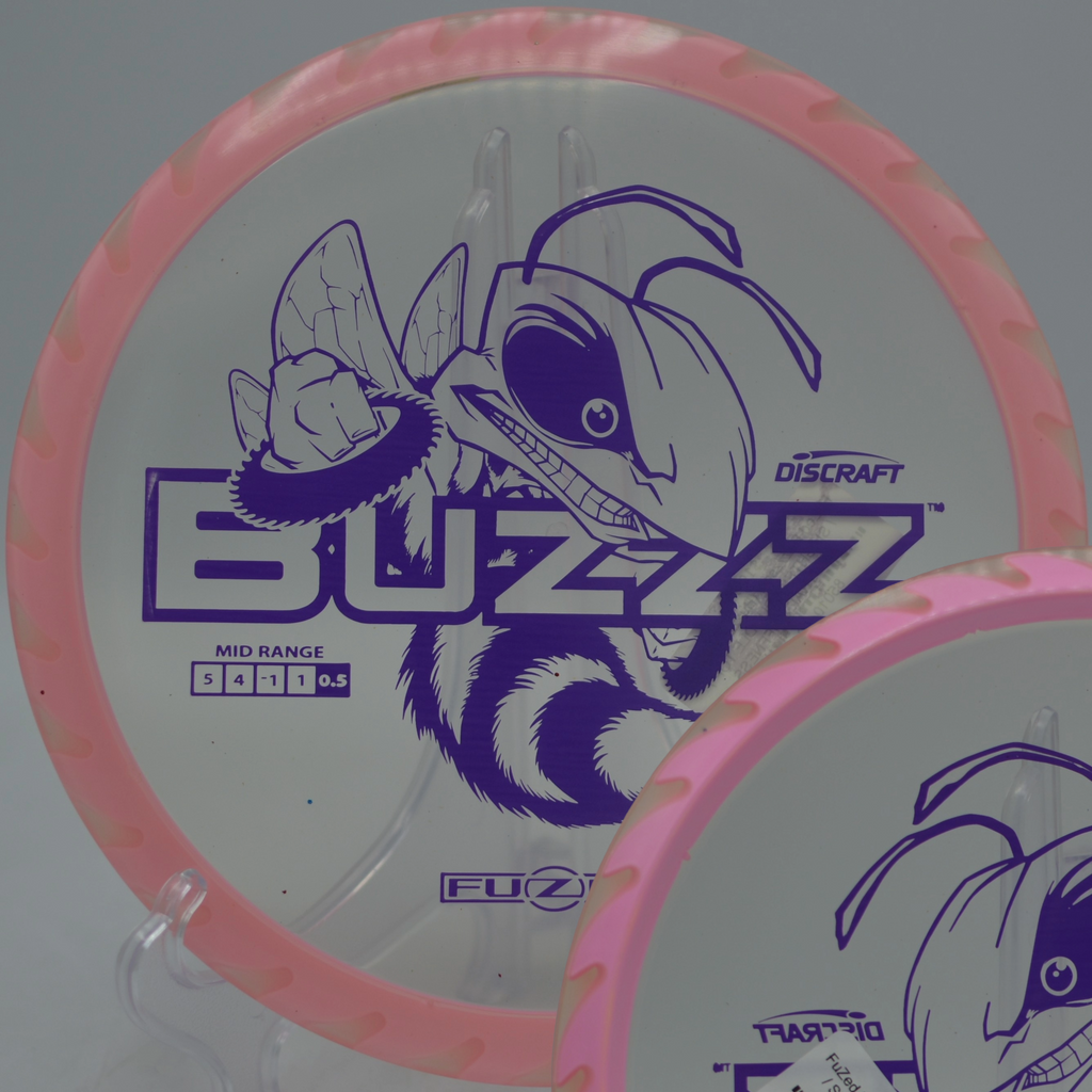 Discraft Fuzed Buzzzsaw gliding straight with gentle fade at Rockburn Branch Park Disc Golf Course in Elkridge, Maryland.