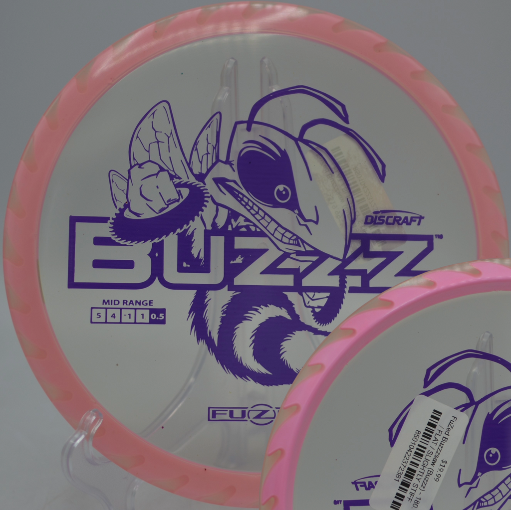 Player releasing a Fuzed Buzzzsaw on a midrange drive at Brandywine Creek State Park Disc Golf Course in Wilmington, Delaware.