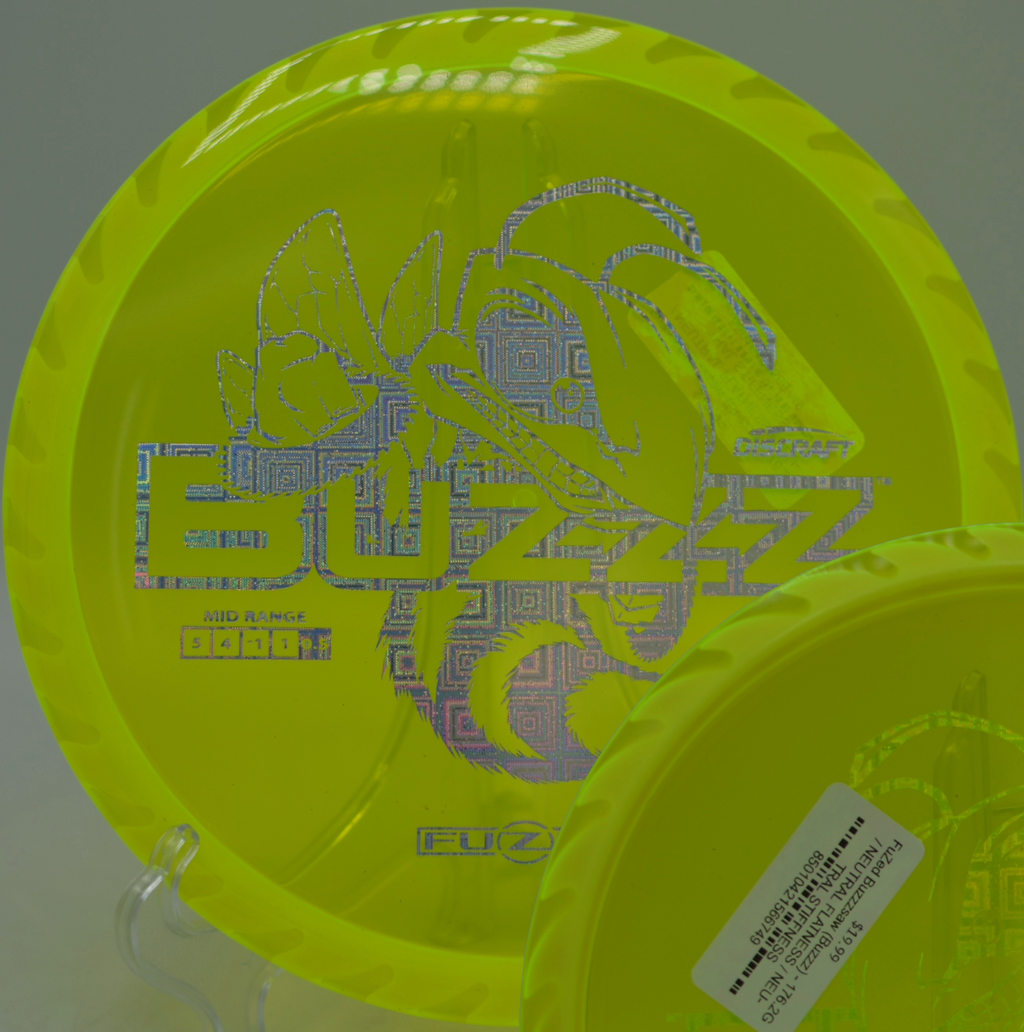 Player shaping a tight tunnel shot with the Fuzed Buzzzsaw at Fox Run Meadows Disc Golf Course in Jeffersonville, Vermont.