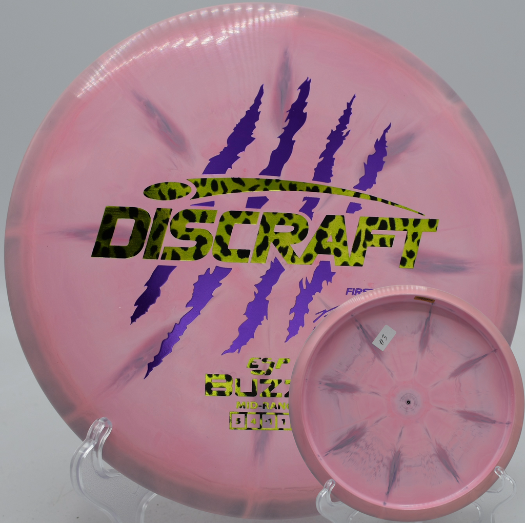 Discraft 4 Claw Buzzz First Run Paul McBeth edition parking a controlled midrange shot at Hornets Nest Disc Golf Course in Charlotte, North Carolina.