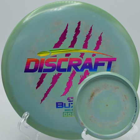 Discraft 4 Claw Buzzz navigating a tight dogleg at Sabattus Disc Golf Course in Sabattus, Maine.