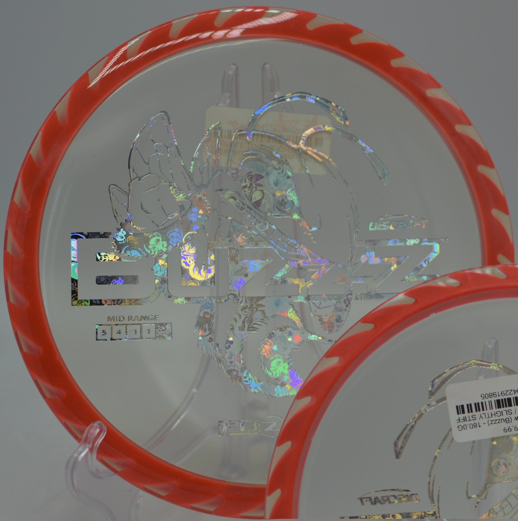 Player throwing a Discraft Fuzed Buzzzsaw on a straight approach at Rockness Monster Disc Golf Course in Greenville, South Carolina.