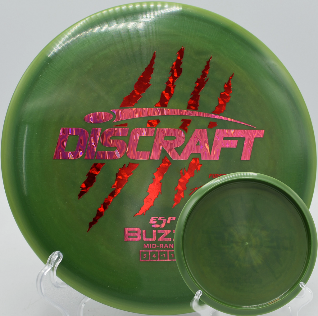 Discraft First Run 4 Claw Buzzz Paul McBeth signature midrange flying straight with glide at Maple Hill Disc Golf Course in Leicester, Massachusetts.