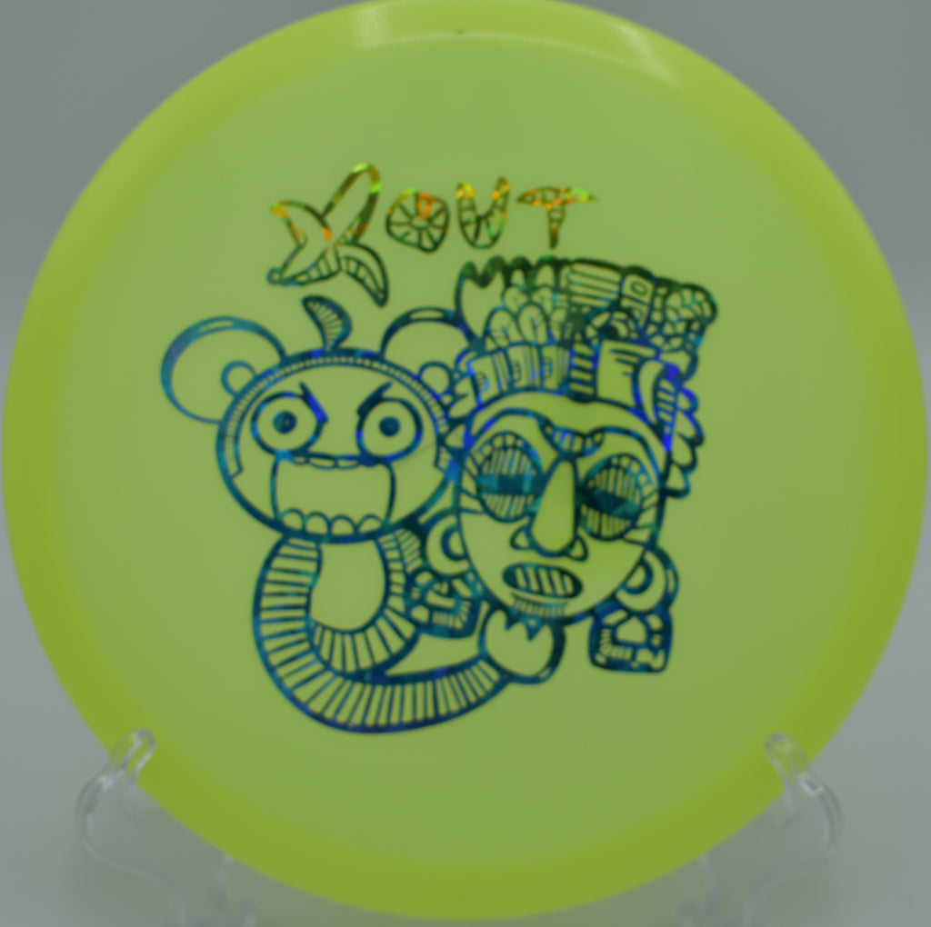Infinite Discs Glow C-Blend Anubis slicing through a wooded gap on Hole 9 at Rock Ridge Disc Golf Course, Pittsboro, North Carolina.
