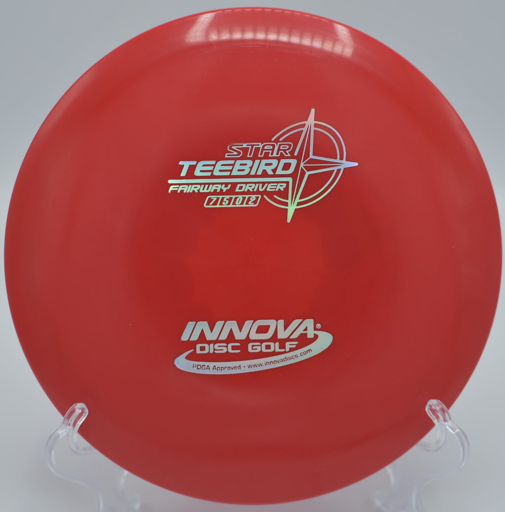 An Innova Star Teebird flying straight down the fairway at Thornfield Disc Golf Course in Stilwell, Kansas, showcasing its pinpoint accuracy.